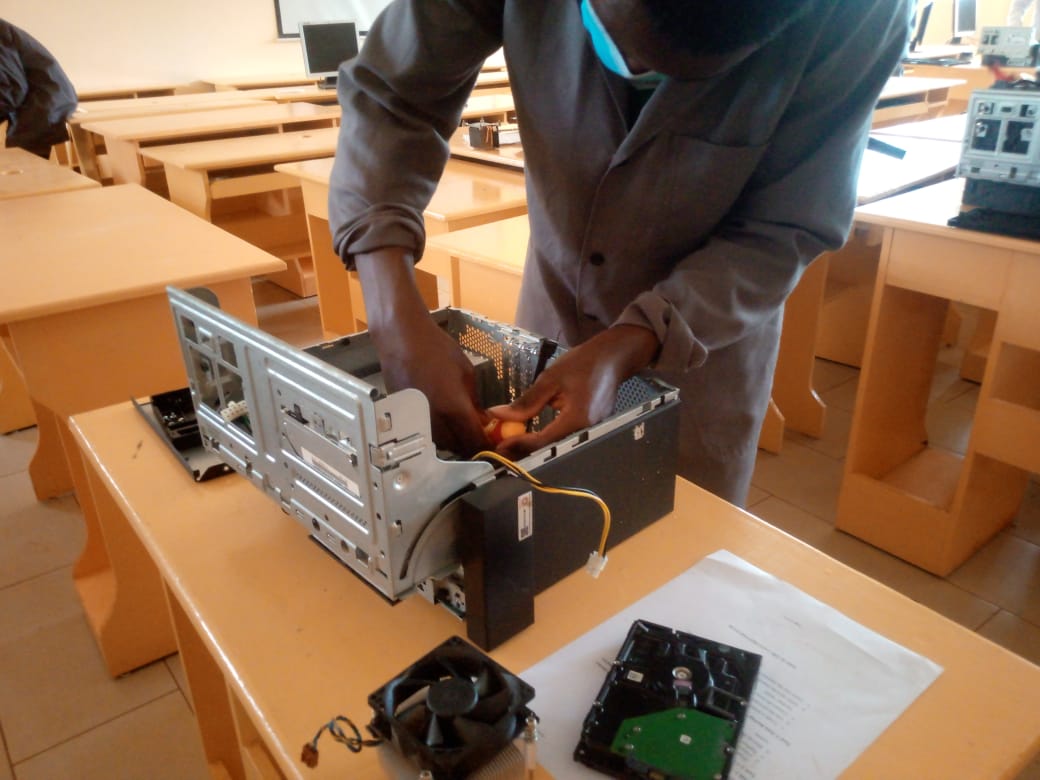 ICT technician trainee demonstrating a skill